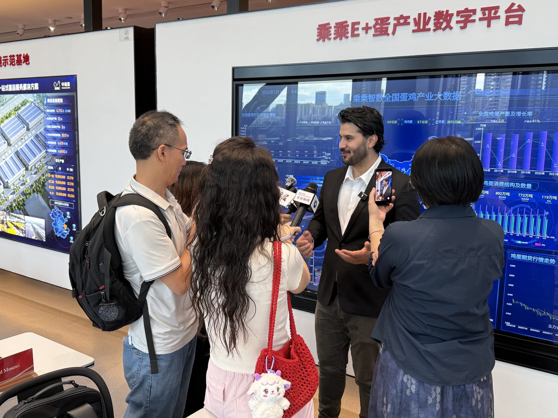 Syed Mosawi interviewed by local media during a site visit in Shenzhen